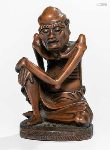 A FINE CARVED BOXWOOD FIGURE OF A KNEELING LOUHAN