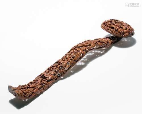 A FINE CARVED BROWN WOOD SCEPTRE WITH LUOHAN AND IMMORTALS