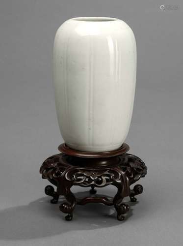 A SMALL WHITE SUBTLY LOBED VASE WITH WOOD STAND, China, 18th/19th ct. - Property from an old German private collection, assembled prior to 1990 -  Minor traces of age