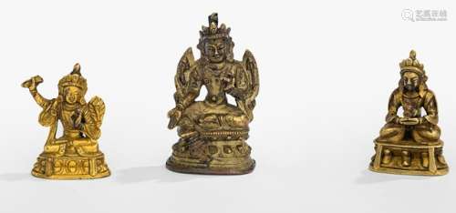 THREE GILT-BRONZE FIGURINES, Tibeto-Chinese, 18th/19th ct., the first depicting Manjushri seated in vajrasana on a lotus base and holding the hilt of a sword, sealed; the second Amitayus supporting with the hands the kalasha, unsealed ; and Syamatara seated in lalitasana, resealed - Property from a German private collection, assembled in the 1970s and 80s - Manjushri with lost blade, minor wear