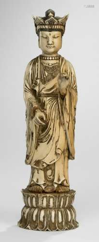 A CROWNED MAMMOTH-IVORY BUDDHA STANDING ON A LOTUS BASE, China, 19th/20th ct. - Property from a Dutch private collection, acquired in Europe before 1990 - Hands made separately, Remnants of gilding, some wear