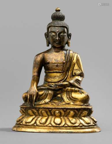 A GILT-BRONZE FIGURE OF BUDDHA SHAKYAMUNI, Tibeto-Chinesisch, 18th ct., seated in vajrasana on a lotus base with his right hand in bhumisparshamudra while the left is resting on his lap, wearing a monastic garment, his face displaying a serene expression with downcast eyes below arched eyebrows running into his nose-bridge, urna, his curled hair and ushnisha topped with a lotus-bud, resealed - Property from an important German private collection, bought from a Dutch collection 1974 - Minor wear
