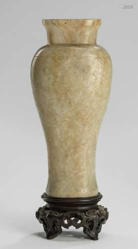 A LIGHT YELLOW JADE VASE WITH FLOWERS AND WAVES, China, Ming dynasty or earlier, carved wood stand - Property from an old Italian private collection, assembled prior 1990 - Slightly chipped, stand with small repair to one leg