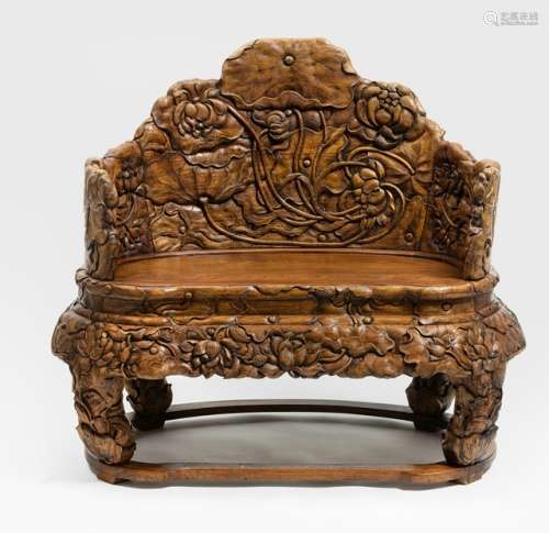 AN ORNATE METICULOUSLY CARVED HARDWOOD THRONE WITH DENSE ALLOVER PATTERN OF A LOTUS POND WITH CRANES, China - Property from an Austrian private collection - Small loss of carving at the reverse side, matching with lot no.524