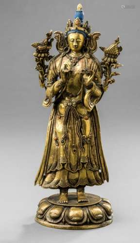 A GILT-BRONZE FIGURE OF A TARA, Tibet, 18th ct., standing in samabhanga on a lotus base with both hands holding stems of lotuses flowering along her upper arms supporting a manuscript and conch, clad in a sari, scarf, jewellery set, with semi-precious stones, her face displaying a serene expression, her blue colored hair coiffed into a chignon topped with a ratna and secured with a tiara decorated with a pair of floating ribbons, unsealed - Property from an important European private collection - Minor wear, lotus repl.