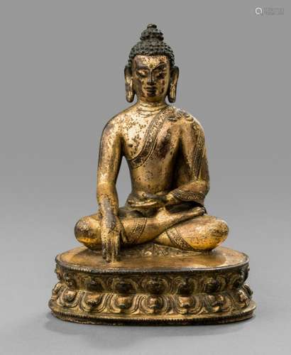 AN INSCRIBED GILT-BRONZE FIGURE OF BUDDHA SHAKYAMUNI, China, Qing dynasty, Qianlong period, dated 1780. Finely cast seated in dhyanasana on a lotus base, his right hand in bhumisparshamudra and his left in dhyanamudra, wearing a simple monks habit incised with a geometric band, his face with meditative expression framed by long pendulous earlobes and his hair curled high in tight knots around the usnisa, the reverse with an eleven-line calligraphic inscription: 