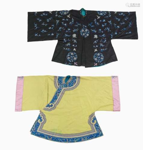 TWO EMBROIDERED LADIES' JACKETS WITH WIDE CUT SLEEVES AND FLORAL PATTERN, China,late Qing period/Republic period - Blue satin silk with floss silk embroidery of flowers and peacocks, the lime green jacket with ornate woven borders and embroidered butterfly pattern - Property from the estate of Georges Schaltenbrand (1897-1979), bought in China between 1928 and 1930 - The lime green jacket stained
