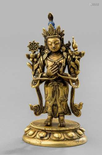 A GILT-BRONZE FIGURE OF MAITREYA, Tibeto-Chinese, late 18th ct. Standing in samabhanga on a separately cast lotus base with both hands holding stems of lotuses flowering along his upper arms, supporting the kundika and chakra, wearing dhoti, bejewelled, his face displaying a serene expression and his blue colored hair combed into a chignon, secured with a tiara. - Provenance: Property from a German private collection, acquired at Bonhams London, 15 May 2014, Lot 339 - Minor wear