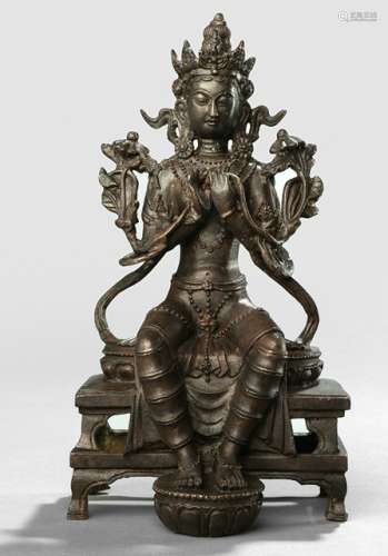 A BRONZE FIGURE OF MAITREYA, Tibet, ca. 19th ct., seated in pralambapadasana on a throne with both feet resting on a lotus base, both hands in dharmacakramudra holding stems of lotuses flowering along his shoulders, wearing dhoti, bejewelled and his face displaying a serene expression - Property from an old European private collection, assembled prior 1990 - Corroded, wear