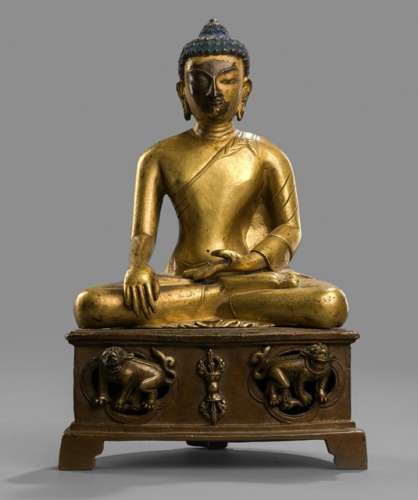 A PART-GILT BRONZE FIGURE OF BUDDHA SHAKYAMUNI SEATED ON A THRONE WITH LIONS, Tibet, 17th/18th ct. - Property from a South German private collection, assembled in the 1990s - Minor wear