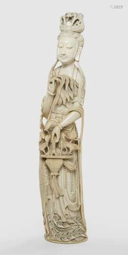 A FINE IVORY CARVING OF AN IMMORTAL WITH FLOWER BASKET AND PHOENIX, China, Yongzheng four-character mark, late Qing dynasty. - Full round and openwork carving, elongated figure, serene face and the emblems skillfully worked as if they were parts of the gown - Similar compositions are known from Dehua porcelain Guanyin sculptures, but without phoenix, so a daoist immortal - Property from an old German private collection, assembled prior to 1990 - Good condition, the reverse with stronger patina