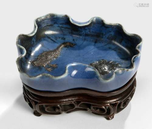 A DARK BLUE LOTUS-SHAPED PORCELAIN BRUSHWASHER, China, Daoguang six-character mark and of the period. The interior decorated with a duck and crab in relief, and with fine leaf-veins across the whole body. - Property from an old Belgian private collection, assembled between 1890 and 1940, by descent to the present owner - With wood stand - Minor wear
