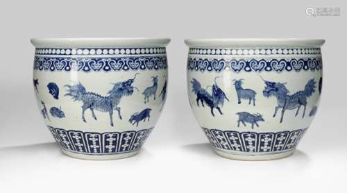 A PAIR OF LARGE UNDERGLAZE BLUE 'ZODIAC' CACHEPOTS, China, Qing dynasty. Depiction of various zodiacs and auspicious animals, including Qilin, deer, rat, hare and horse under a Ruyi-shaped border. Border of stylized lotus flowers to the foot. Flattened top rim with prunus blossom border. - Former property from an Austrian private collection - Glazing flaws to the top rim and some other places, inside one with a small hairline crack, on the lower rim with one small area of glaze corrosion
