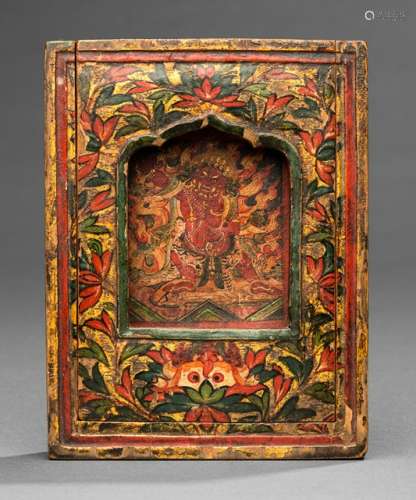 A PAINTED WOOD AMULET-BOX WITH TSAKLI, OUTER MONGOLIA, 19th ct.., The rectangular wood amulet-box with sliding door to the front painted with scrolling tendrils, the inside with minute painting on cotton depicting standing Hayagriva on a lotus base - Provenance: Property from a German private collection, acquired between 1965 and 1989 - Traces of age