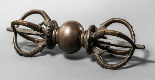 A LARGE BRONZE VAJRA, Tibet, 19th/20th ct., the diamond scepter cast with a central globular-pressed knob flanked to each side by a lotus-petal band supporting four makara-heads each issuing a curved prong around a central rod - Property from an old Dutch private collection, assembled from 1950 till the 1990s, by descent to the present owner - Minor wear