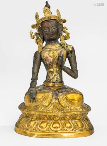 A PARCEL GILT-COPPER EMBOSSED FIGURE OF SITATARA, Tibeteo-Chinese, 19th ct., seated in vajrasana on a lotus base, both hands showing a form of vitarkamudra, wearing a sari, scarf and bejewelled and her face displaying a serene expression with downcast eyes, unsealed - Property from an old European private collection, assembled prior 1990 - Minor wear, attributes partly lost, small old repairs