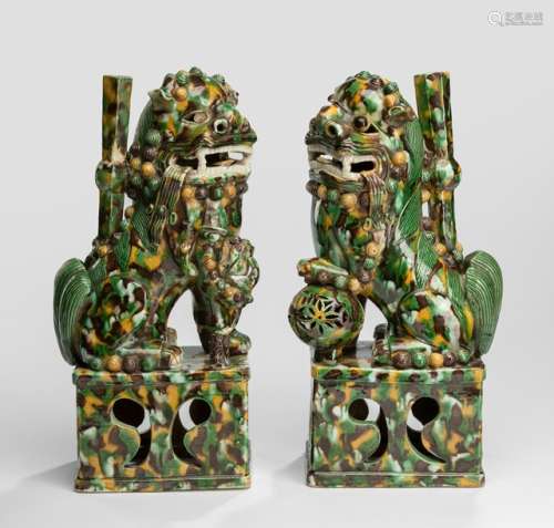 A PAIR OF 'SANCAI'-GLAZED BUDDHIST LION JOSS-STICK HOLDERS, China, Kangxi period. - Property from an old Belgian private collection, assembled between 1890 and 1940, by descent to the present owner - Right eye of one lion lost, minor chips and firing cracks