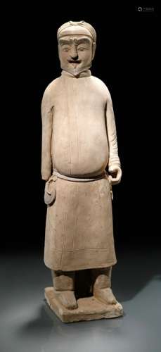 A PAINTED POTTERY FIGURE OF A FOREIGN GROOM, Northern Qi or Northern Han dynasty, 2nd half of 6th ct. Potted of pale buff clay, resting on a thick plinth, with reinforcement behind the boots. The figure wearing a long coat and heavy boots, its face with a fierce expression, one hand bent as if holding something, the other is missing. Traces of several pigments. Age measurement confirmed by Thermoluminescence Analysis 30th November 1998 (Oxford Authentication, no. C298h98). - Provenance: Bought in 1996 from L.H.W. Investment & Trading Limited, Hong Kong. - Described and illustrated in: Regina Krahl: Collection Julius Eberhardt. Early Chinese Art, vol. 1, Hong Kong 1999, pp. 48 and 202f.