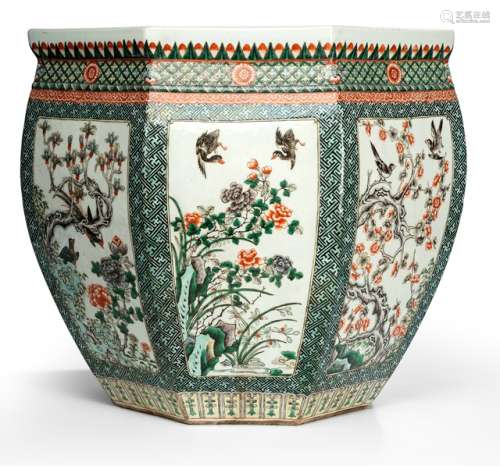 A PAIR OF LARGE OCTAGONAL 'FAMILLE VERTE' CACHEPOTS WITH BIRD AND FLOWER DECOR, China, Guangxu period. The eight cartouches each showing different pairings of flowers such as magnolia blossoms, chrysanthemums, prunus and peach blossoms, peonies, and lotus and birds such as swallows, ducks, pheasants and magpies. - Property from an old Italian private collection, acquired between 1960 and 1990 - With hardwood stands - Minor chips, traces of age
