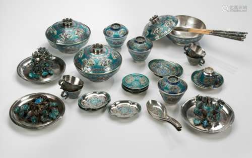 A 37-PIECE SILVER AND ENAMEL SERVICE, China, 19th ct. Consisting of three table ornaments, three bowls with covers, three cups and saucers, six separate saucers, five cups with handles, three lobed saucers, three spoons, and five chopsticks. - Property from a Dutch private collection, acquired before 1990 - Two small cups with wear, otherwise minor wear