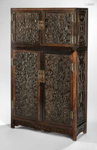A FINE BUDDHIST EMBLEMS AND CLOUD CARVED HARDWOOD CABINET, China, Qing dynasty - Property from a Diplomate collection, bought from the estate of an old Japanese private collection - Small repairs, traces of age