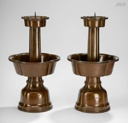 A PAIR OF BRONZE CANDLE HOLDERS, China, 18th/19th ct. - Property from a Dutch private collection - Sticks replaced, filled drilled holes to base