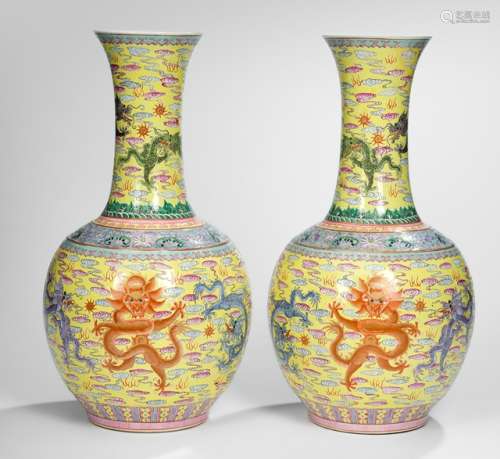 A PAIR OF YELLOW-GROUND 'FAMILLE ROSE' DRAGON VASES, China, Qianlong six-character mark, Republic period. - Property from a South German private collection, assembled in the 1990s - Very minor wear