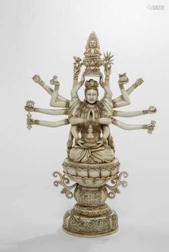 A FINE CARVED IVORY 'THOUSAND ARM' GUANYIN SEATED ON A LOTUS THRONE, China, Chenghua four-character mark, late Qing/Republic period, carved full round and mounted of various elements to create the impression of a thousand arms holding the emblems and honouring Buddha, ornate stand of the throne decorated with the character 'fo' hidden in the scroll of a branch - Property from an old German private collection, assembled prior to 1990 - Minor traces of age, protruding extremities glued