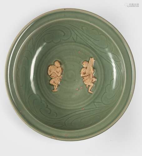 A RARE LARGE CELADON PLATE WITH TWO UNGLAZED MOULDED FIGURES IN THE CENTER, China, possibly Yuan/early Ming dynasty - Property from an old South German private collection, bought prior 1982 - Cf. 'Chinese Celadons and other Related Wares in South East Asia', Southeast Asian Ceramics Society, Singapore June 1979, no. 176 - Few small glaze faults