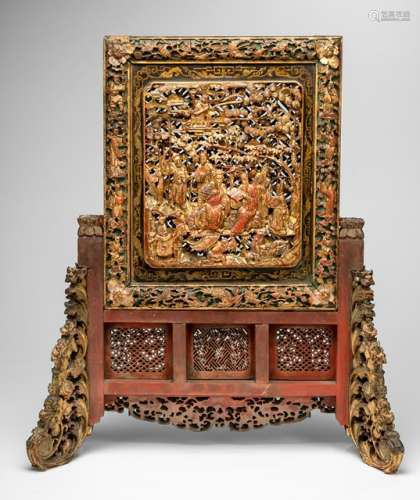 A FINE CARVED SCREEN DEPICTING A FIGURAL SCENE AND CARVED CINNABAR LACQUER PANEL ON THE REVERSE, China, 19th ct., gold and red lacquer finish on wood, with highlighting colors - Property from an old German industrialist collection, assembled between 1950 and 1990 - Traces of age, minor wear to gilt lacquer, one part of the stand loose, partly chipped