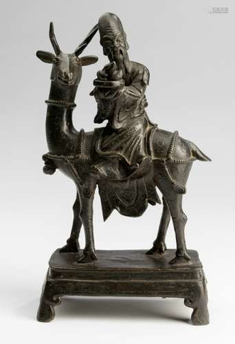A BRONZE FIGURE OF SHOULAO RIDING A STAG, China, Kangxi period - Property from an Austrian private collection, acquired before 2016 - Minor wear