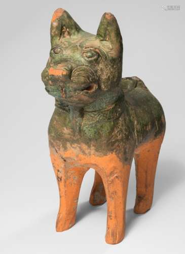 A PART-GREEN GLAZED EARTHENWARE MODEL OF A STANDING DOG, China, Han dynasty - Property from the estate of Emil Jannnigs (1884-1950) gifted to the present owner - Partly chipped, minor restoration