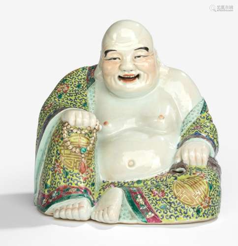 A POLYCHROME PORCELAIN BUDAI, China, late Qing/early Republic period. - Property from an old German family collection, assembled in China around 1912 - Tiny hairline crack to the bottom, otherwise good condition