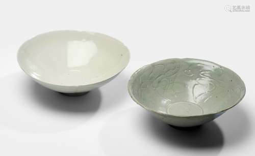 TWO SLIGHTLY LOBED CELADON AND 'DINGYAO' BOWLS, China, Yuan dynasty - Property from an old Berlin private collection, acquired at Ruth Schmidt, Berlin, 12 Sep 1987 and at Klefisch, Cologne, 16 Nov 1991, 48A, Lot 887 - One bowl with a slightly chipped footring, minor wear