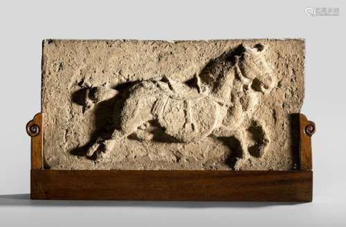 A TERRACOTTA BRICK MOULDED WITH A HORSE, China, Ming dynasty, on base. The rectangular brick moulded with a running horse equipped with bridle and saddle - Property from an old Dutch private collection, assembled from 1950 till the 1990s, by descent to the present owner - Partly chipped