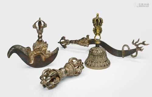 A SILVERED BRONZE VAJRA AND TWO RITUAL DAGGERS AND A BRONZE GHANTA, Tibet, 19th/20th ct. - Property from a German noble collection - Wear