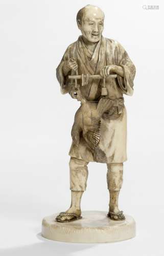 AN IVORY OKIMONO OF A PEASANT MAN CARRYING A CHICKEN ON A RACK