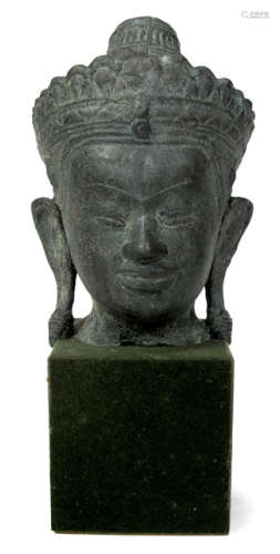 A BRONZE HEAD OF A BUDDHA