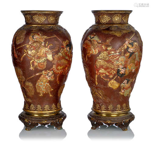 A PAIR OF ZINC VASES DECORATED WITH WARRIORS