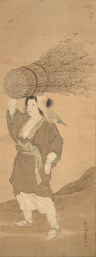 A WOMAN COLLECTING FIREWOOD