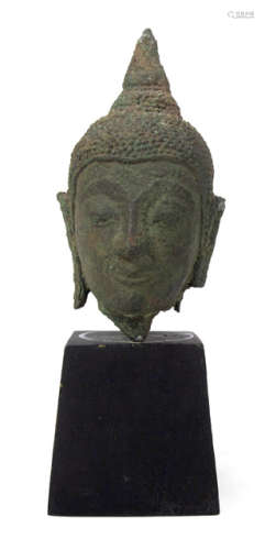 A LITTLE BRONZE HEAD OF BUDDHA SHAKYAMUNI
