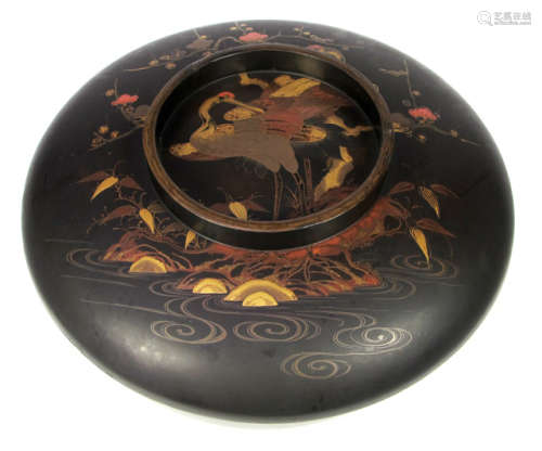 A LARGE BLACK LACQUER BOX AND COVER DECORATED WITH CRANES