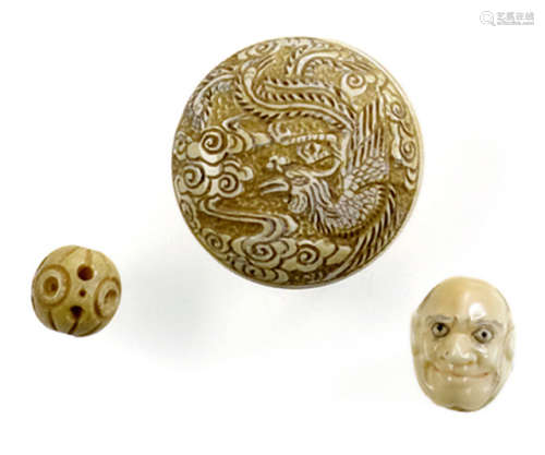 AN IVORY MANJU WITH A PHOENIX AND TWO OJIME