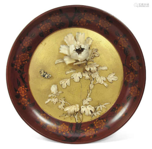 A LACQUERED PLATE WITH FLORAL IVORY CARVING