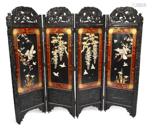 A FOUR PANEL WOOD SCREEN WITH IVORY AND MOTHER OF PEARLS PATTERN