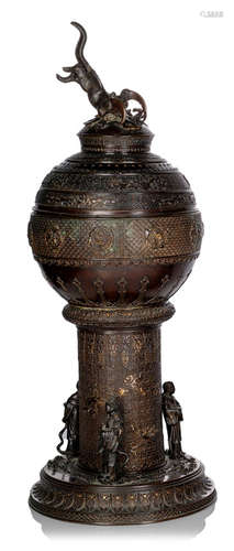 A FOOTED BRONZE KORO AND COVER DECORATED WITH STYLIZED DRAGONS AND VARIOUS PATTERNS