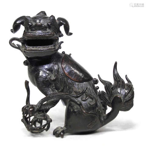 A BRONZE CENSER IN SHAPE OF A BUDDHIST LION