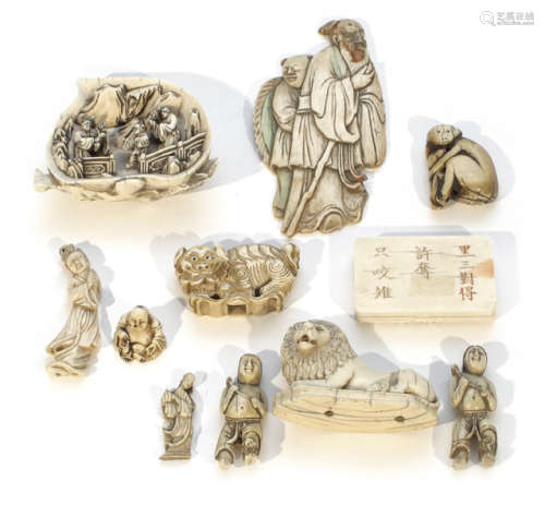 A GROUP OF 11 MOSTLY FIGURAL IVORY CARVINGS