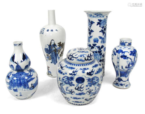 FOUR BLUE AND WHITE DECORATED PORCELAIN VASES AND ONE VASE AND COVER