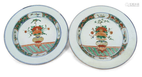 A PAIR OF LARGE PORCELAIN PLATES DEPICTING EACH A VASE AND FLOWERS